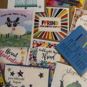 Collection of greeting cards with various designs and text.