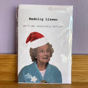 Card with a person wearing a Santa hat and text on a purple background