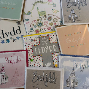 Collection of greeting cards with 'Bedydd' text and various designs.