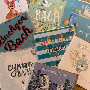 Collection of greeting cards with various designs and text, including 'Bachgen Bach' and 'Cymro Bach'.