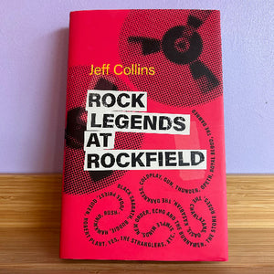 Book titled 'Rock Legends at Rockfield' by Jeff Collins with a red cover on a wooden surface.