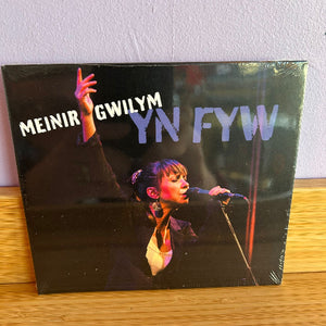 CD with a person performing on stage and text 'MEINIR GWILYM YN FYW' on a plain background.