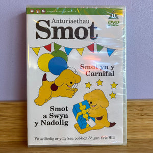 DVD cover with cartoon dogs and festive elements on a wooden surface.