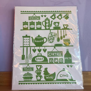 Decorative kitchen-themed poster with green graphics on a white background, placed in clear plastic packaging.