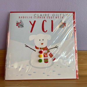 Christmas card  with a snowman illustration on a wooden surface