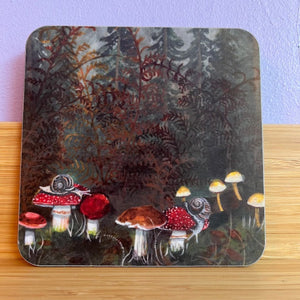 Coaster with mushroom design on a wooden surface