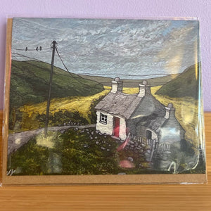 Painted landscape with a house and hills on a card