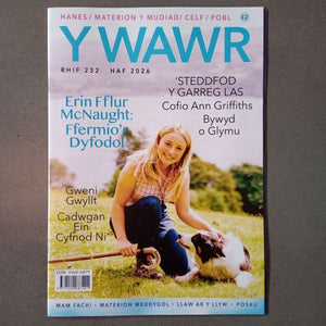 Magazine cover with a woman and dog on a grassy field, featuring the title 'YWAWR' and additional text.